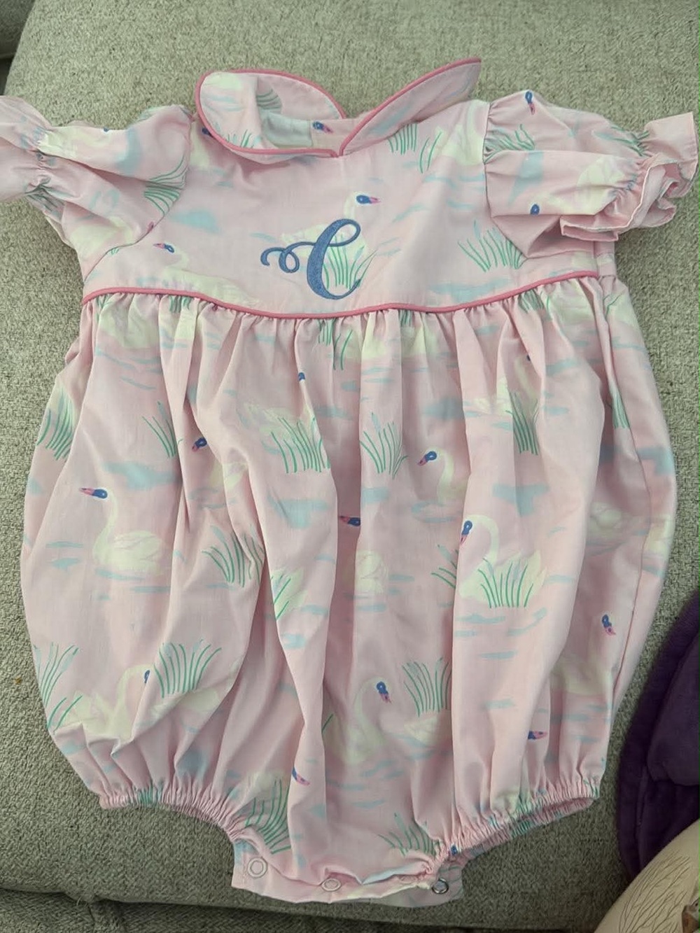 The Beaufort Bonnet Company Pink Swan Print Smocked Romper “c” monogram runs